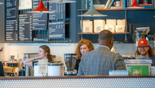 Caregiver holding older woman's hand outdoors