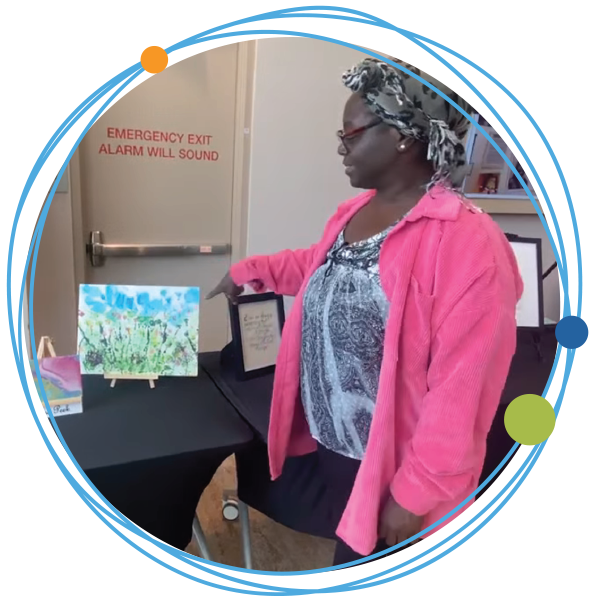 Artist showing her painting