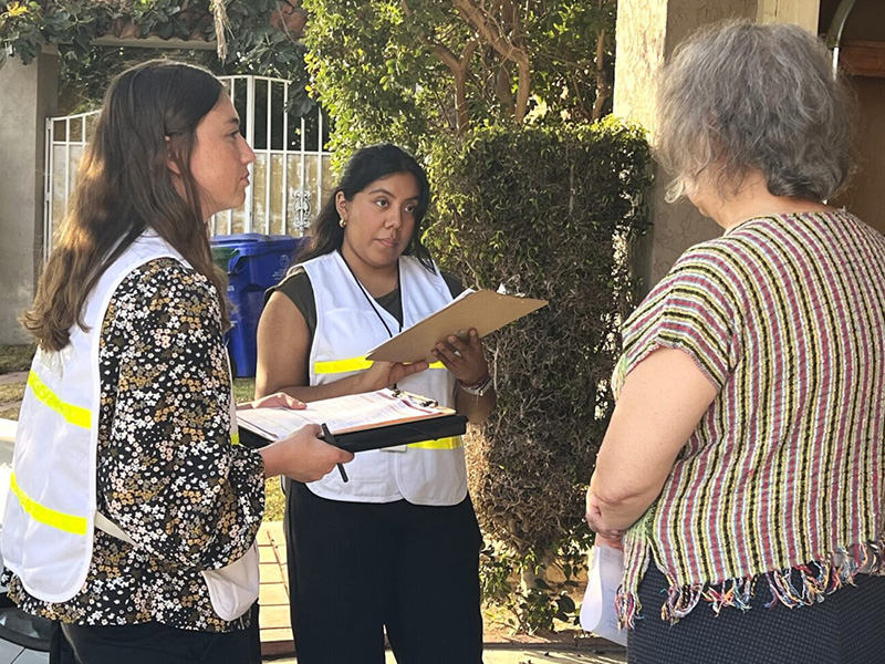 County worker surveying residents