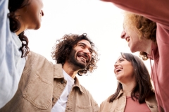 Friends huddled together and laughing