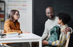 Provider speaking with student and parent