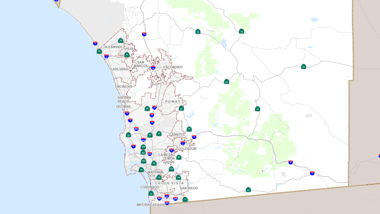 Recreational building at a county park with bushes and flowers