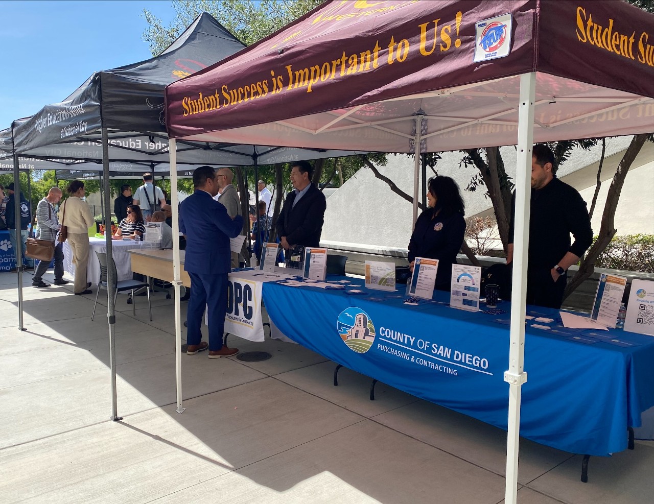 Multiple people tabling at a resource event 