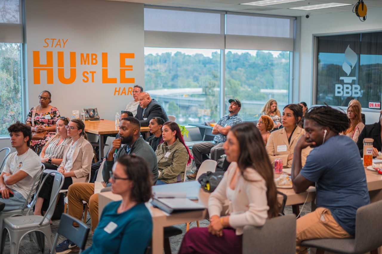 people sitting listening audience style