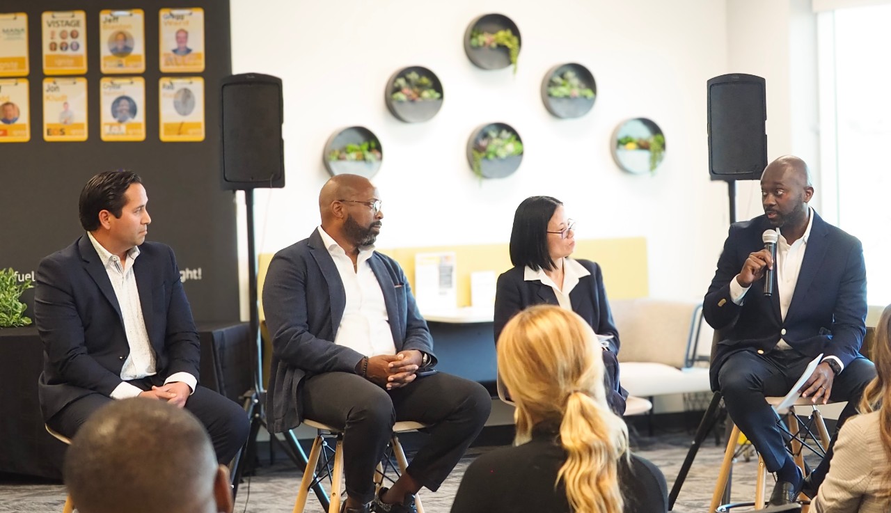 Business Panel with four individuals speaking