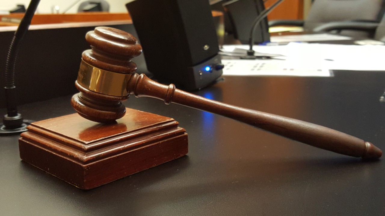 A gavel sitting on a desk