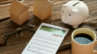 calculartor and piggy bank - collecting child support