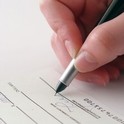 Person filling out paperwork