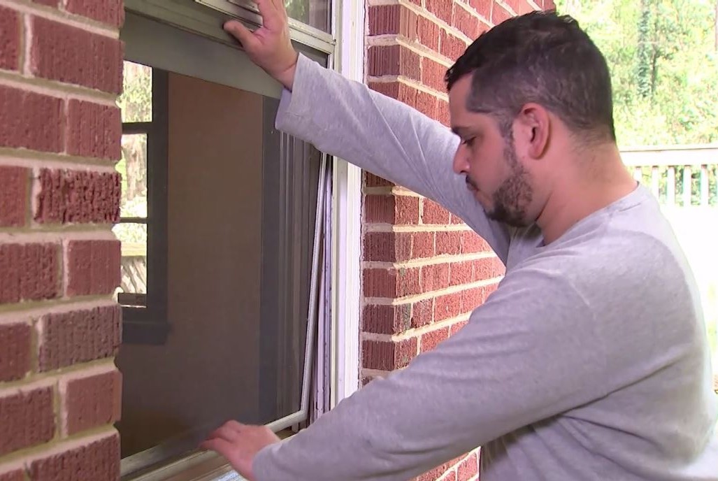 Window screen being installed