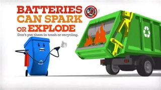 Red letters at top left read, "batteries can spark or explode. don't put them in trash or recycling". A blue recycle rolling cart with a nervous face, holds a fire extinguisher trying to put out a fire in the back of a green trash truck.
