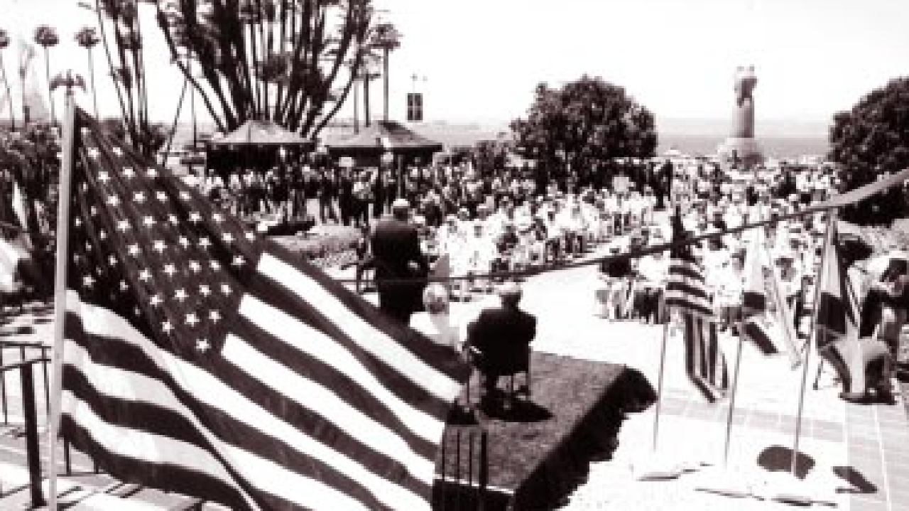 A picture from the front steps of the County Administration Center of people gathered on the lawn in front of the building for the 60th anniversary event