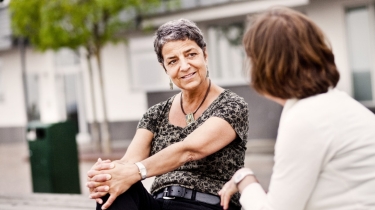 Woman in the community receiving ACT services from a case manager