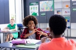 Smiling young student in classroom