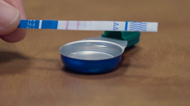 Fentanyl test strip being used to test a drug
