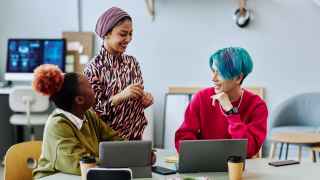 Diverse group of people chatting during a meeting