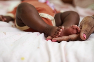 Mother Touching Feet of Baby