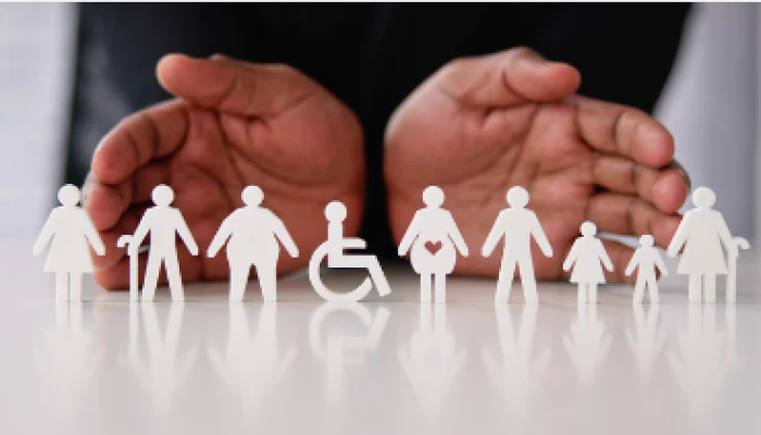 CCS Stock photo of paper cutouts of a family, including a disabled family member.