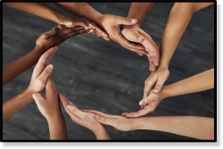 People holding hands in a circle