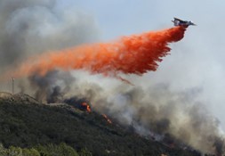 plane dropping fire retardant