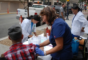 County of San Diego healthcare providers passing out vaccines during a Hepatitis A vaccine event.