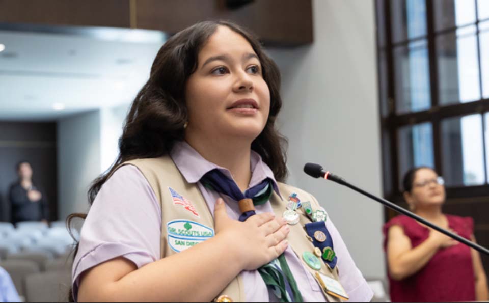 Woman speaking in front of a microphone