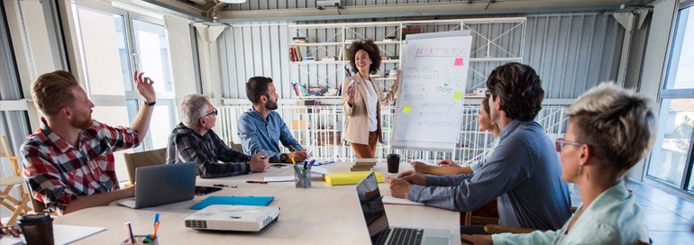 Group of professionals meeting and collaborating on ideas.