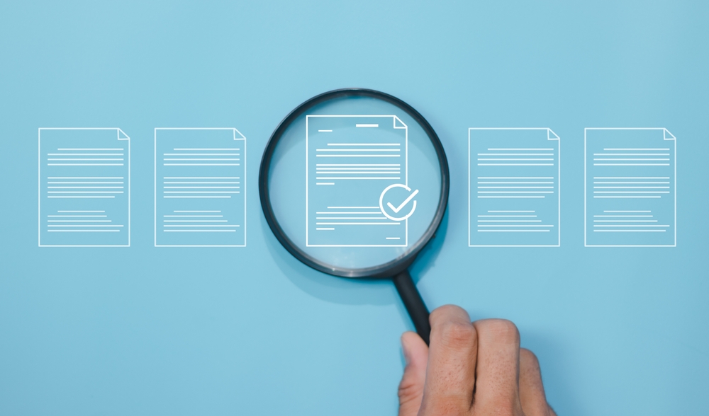 Document quality control concept. Magnifying glass focus on correct sign mark with document approve paperless and quality assurance approve. Rules of conduct and policies.