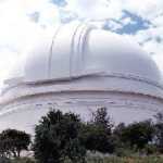 Palomar Observatory with a cloudy sky above it