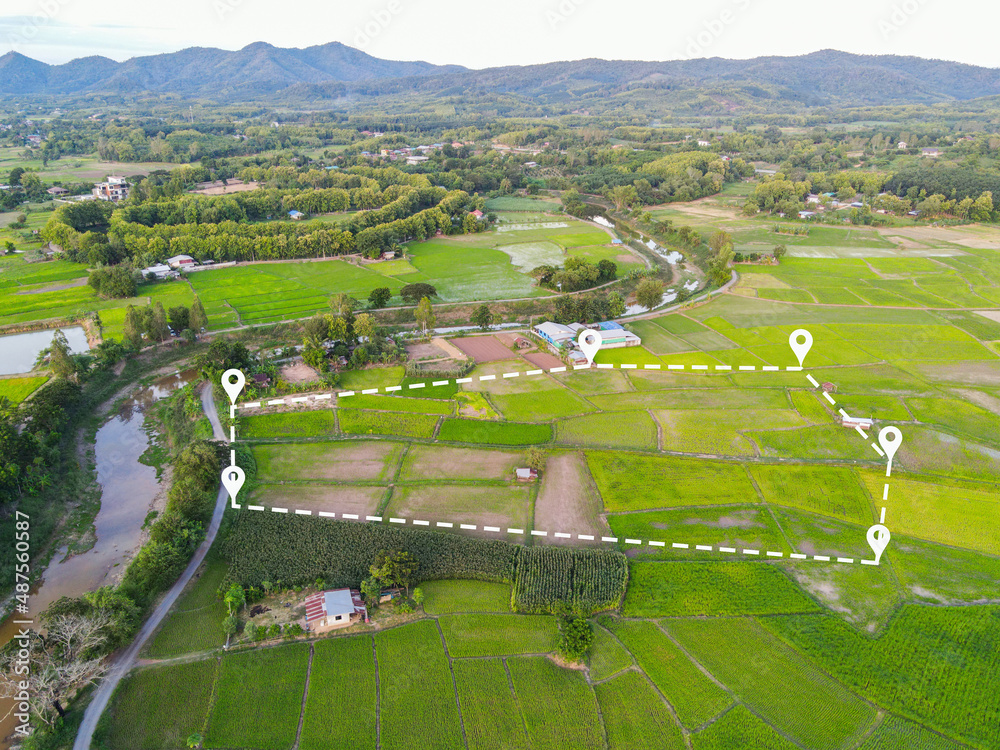 Aerial view of rural land, with pinpoint markers identifying property boundaries