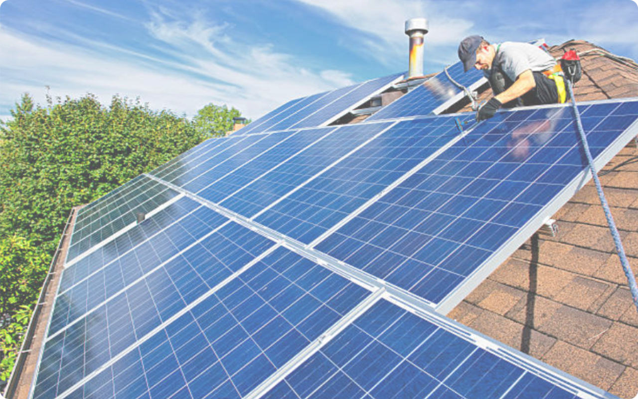 Man Installing Solar Panels, representing minor residential permit