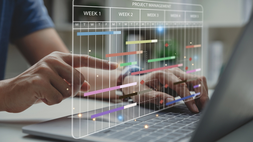 Project manager working with Gantt chart schedule to update the schedule, Management diagram with planning software on laptop screen.