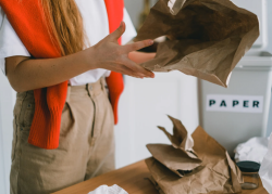 Individual holding paper materials.
