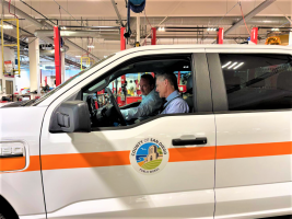 County Staff Sitting in a County Hybrid Vehicle
