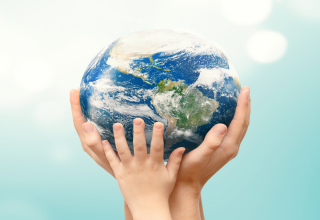 Hands holding up earth